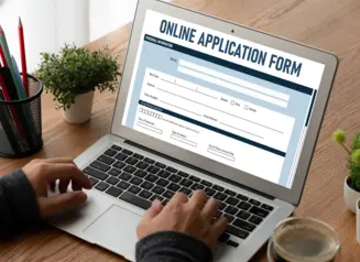 Laptop with online application form.