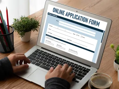 Laptop with online application form.